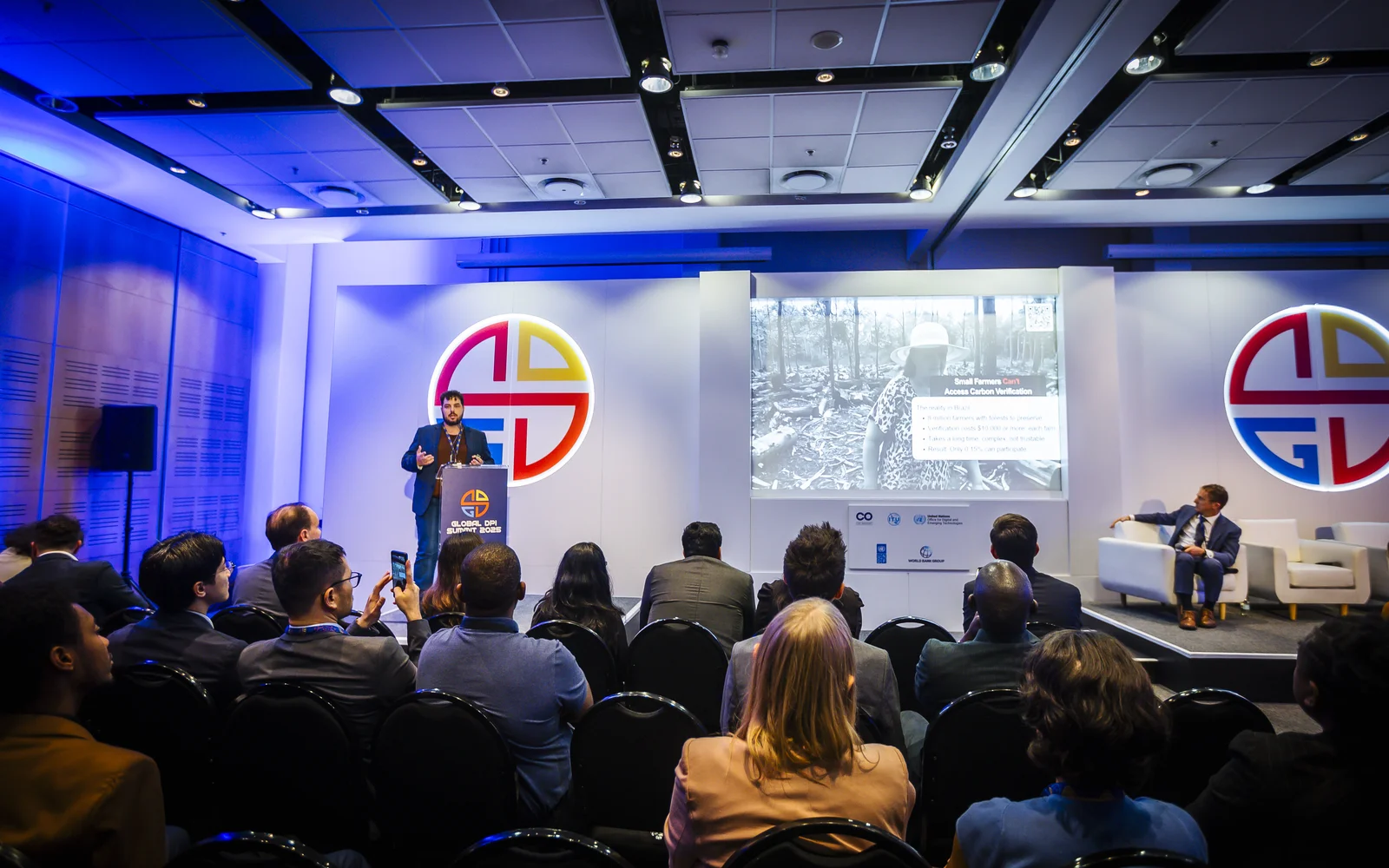 Global DPI Summit 2025 auditorium during the DPI for People and Planet Innovation Challenge winner showcase — Trust Carbon presenting carbon verification infrastructure built on Brazil's Digital Public Infrastructure